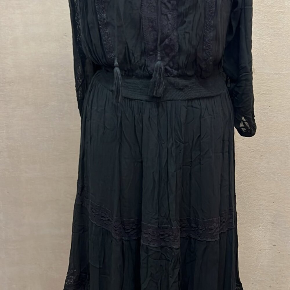 Black Bahamian style dress by Miss June Paris.